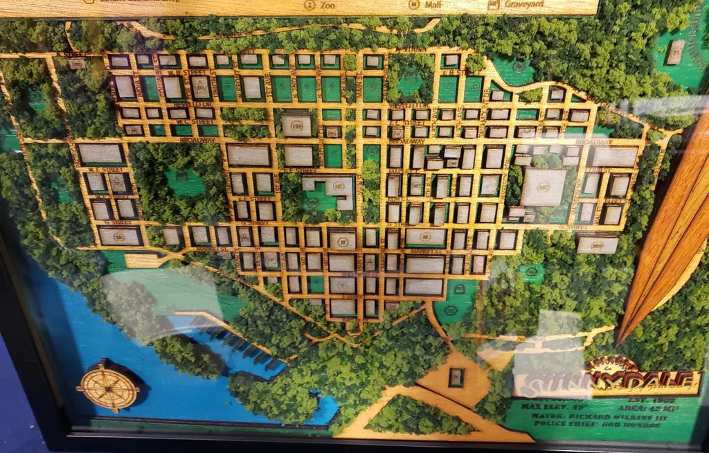 Deluxe form of this map features 7 layers of 3mm wood, 4 primary paint colors, fake tree & bushes, and blue resin in the waterways.